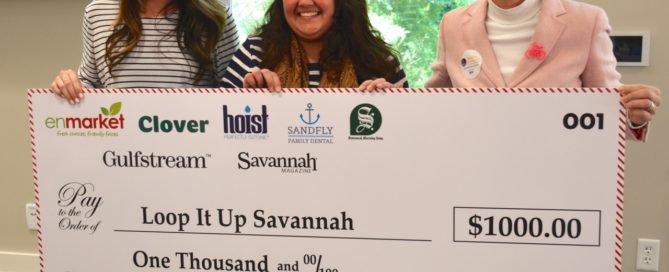 Enmarket and Healthy Savannah presents check to LOOP IT UP SAVANNAH