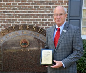 Bethesda Academy President Michael Hughes Holds GOAL Award