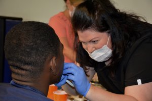 Angela Canfield Sandfly Family Dental Donates Mouth Guards to Bethesda Academy - 2017 Canfield Mouth Shield