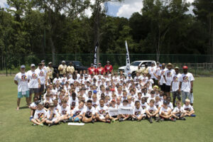 Group photo at Kids and Pros Football Camp Presented by Peacock Automotive