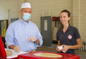 Stratton Leopold of Leopold’s Ice Cream poses with Jessica Putney, Paramedic